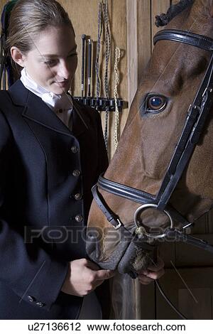 Female horseback rider with horse View Large Photo Image Stock Image - Female horseback rider with horse. Fotosearch