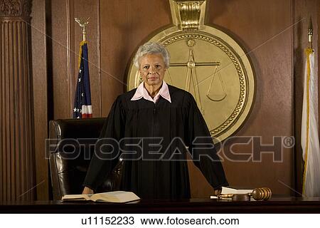 Female judge standing in court portrait View Large Photo Image Stock Image - Female judge standing in court portrait. Fotosearch