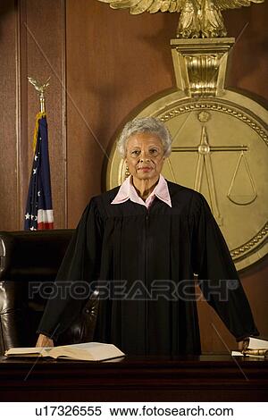 Stock Photography - Female judge standing in court portrait. Fotosearch