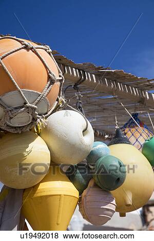 Stock Photo - Fishing floats hanging on porch. Fotosearch