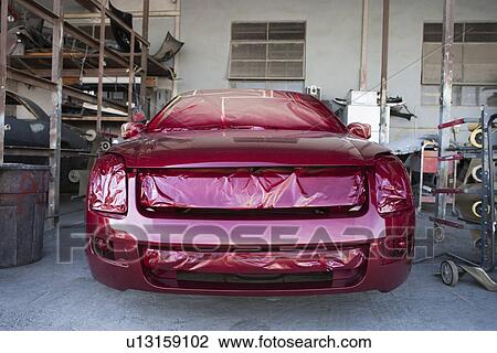 Front of red painted car in garage View Large Photo Image Stock Image - Front of red painted car in garage. Fotosearch