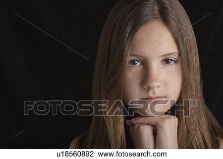 Girl (10-12) on black background portrait View Large Photo Image Stock Image - Girl (10-12) on black background portrait. Fotosearch
