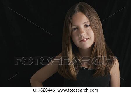Girl (10-12) on black background portrait View Large Photo Image Stock Photography - Girl (10-12) on black background portrait. Fotosearch