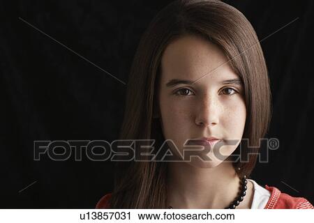 Girl (13-15) on black background portrait View Large Photo Image Stock Image - Girl (13-15) on black background portrait. Fotosearch