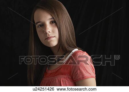 Girl (13-15) on black background portrait View Large Photo Image Stock Photograph - Girl (13-15) on black background portrait. Fotosearch