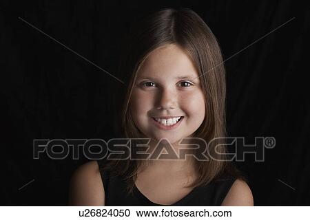 Girl (5-6) on black background portrait View Large Photo Image Stock Image - Girl (5-6) on black background portrait. Fotosearch