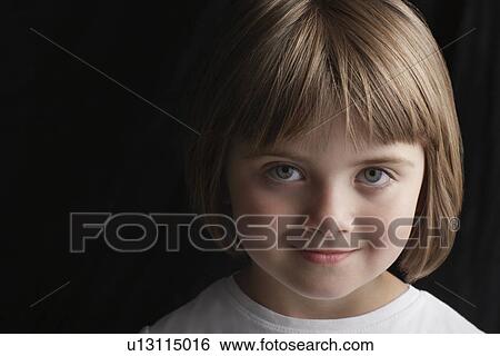 Girl (5-6) on black background portrait close-up View Large Photo Image Stock Photograph - Girl (5-6) on black background portrait close-up. Fotosearch