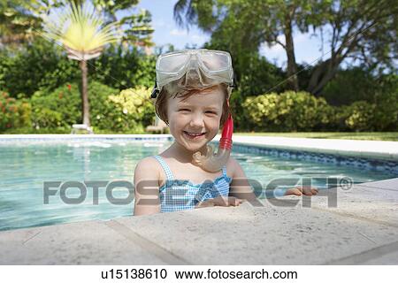 Girl (5-6) snorkelling in swimming pool portrait View Large Photo Image Stock Image - Girl (5-6) snorkelling in swimming pool portrait. Fotosearch