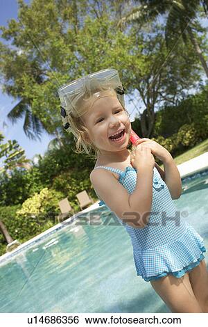 Girl (5-6) wearing snorkelling gear laughing View Large Photo Image Stock Photograph - Girl (5-6) wearing snorkelling gear laughing. Fotosearch