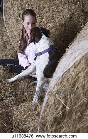 Girl and dog in barn View Large Photo Image Stock Photograph - Girl and dog in barn. Fotosearch