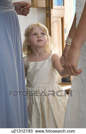 Stock Image - Girl at wedding reception. Fotosearch