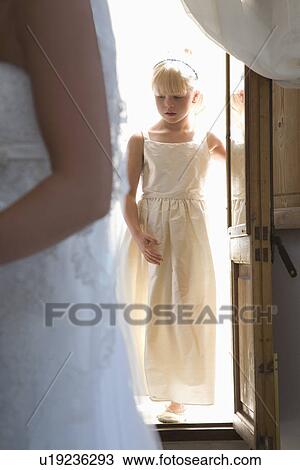 Girl entering house during wedding reception View Large Photo Image Stock Image - Girl entering house during wedding reception. Fotosearch