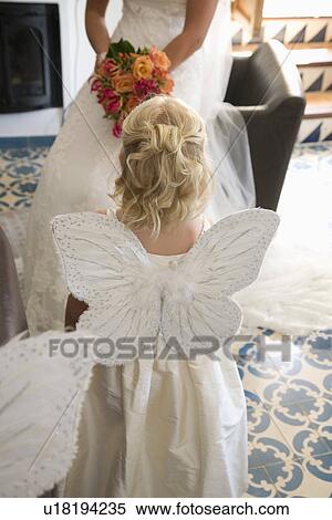 Girl wearing butterfly wings at wedding ceremony View Large Photo Image Stock Photography - Girl wearing butterfly wings at wedding ceremony. Fotosearch