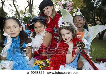 Girls (7-12) wearing colorful costumes View Large Photo Image Stock Photograph - Girls (7-12) wearing colorful costumes. Fotosearch