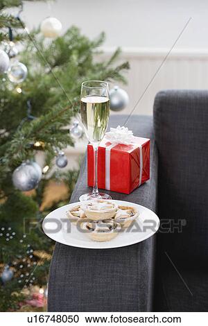 Glass of champagne and mince pies on armchair View Large Photo Image Stock Image - Glass of champagne and mince pies on armchair. Fotosearch