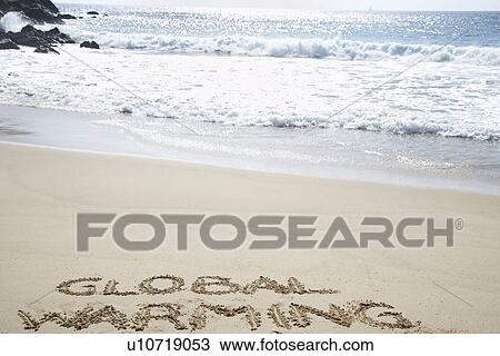 Global warming text written in beach elevated view View Large Photo Image Stock Image - Global warming text written in beach elevated view. Fotosearch