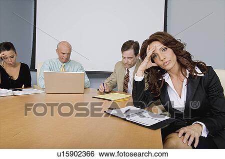 Group of Serious Business People at a Meeting View Large Photo Image Stock Photograph - Group of Serious Business People at a Meeting. Fotosearch