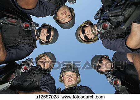 Group portrait of Swat officers standing in circle View Large Photo Image Stock Photo - Group portrait of Swat officers standing in circle. Fotosearch
