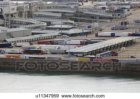 Harbor with trucks and ship View Large Photo Image Stock Photo - Harbor with trucks and ship. Fotosearch
