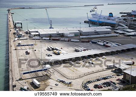 Harbor with trucks and ship View Large Photo Image Stock Photo - Harbor with trucks and ship. Fotosearch