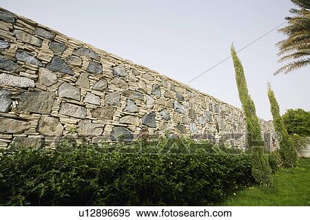 Hedge in Front of Stone Wall View Large Photo Image Stock Photography - Hedge in Front of Stone Wall. Fotosearch