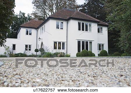 House exterior with surrounding yard and driveway View Large Photo Image Stock Photo - House exterior with surrounding yard and driveway. Fotosearch