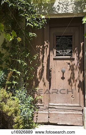 Stock Photo - Hut overgrown with weed. Fotosearch