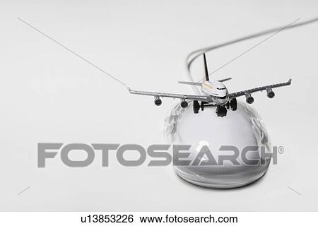 Stock Photograph - Jumbo jet on apple macintosh computer mouse digital composite. Fotosearch