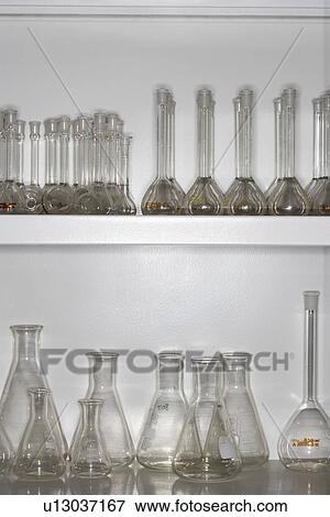 Laboratory flasks on shelves View Large Photo Image Stock Photo - Laboratory flasks on shelves. Fotosearch