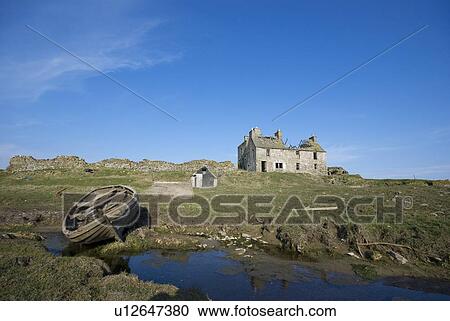 Stock Image - Landscape with abandoned house and boat. Fotosearch