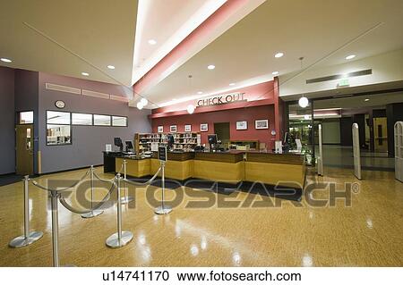 Stock Image - Library checkout desk. Fotosearch
