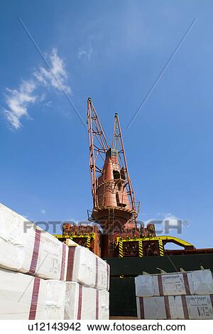 Limassol Cyprus. Cranes loading a freighter with cargo on quayside View Large Photo Image Stock Image - Limassol Cyprus. Cranes loading a freighter with cargo on quayside. Fotosearch