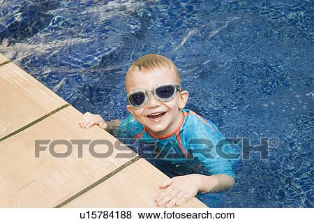 Little Boy in a Swimming Pool View Large Photo Image Stock Photo - Little Boy in a Swimming Pool. Fotosearch