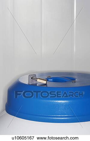 Stock Photo - Lock on top of nitrogen tank close up. Fotosearch