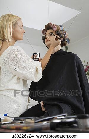 Picture - Makeup Artist Preparing Model. Fotosearch
