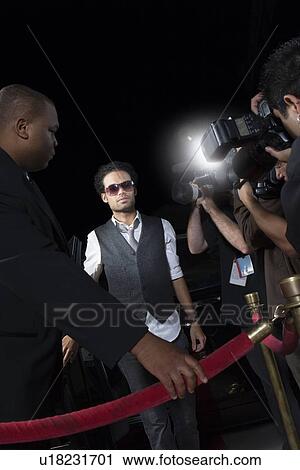 Male celebrity arriving at media event View Large Photo Image Stock Image - Male celebrity arriving at media event. Fotosearch