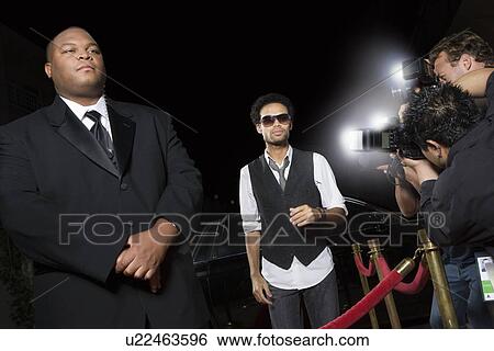 Stock Photograph - Male celebrity arriving at media event. Fotosearch