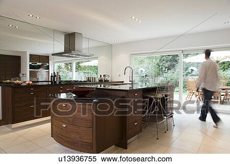Man in Modern kitchen View Large Photo Image Stock Photography - Man in Modern kitchen. Fotosearch