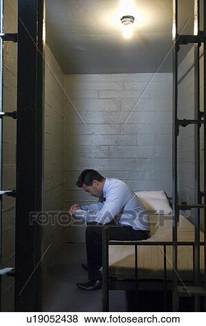 Stock Photo - Man in prison. Fotosearch