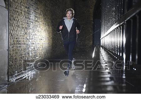Man jogging at night View Large Photo Image Stock Photo - Man jogging at night. Fotosearch