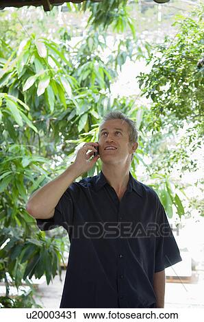 Man Outside Using Cell Phone View Large Photo Image Stock Image - Man Outside Using Cell Phone. Fotosearch