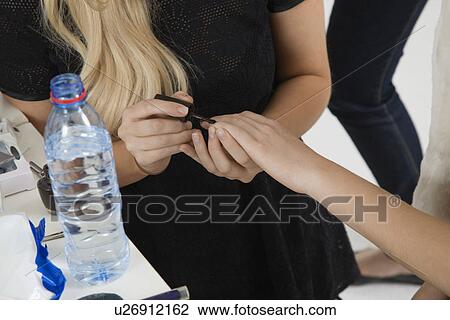 Manicurist Painting Nails of Model View Large Photo Image Stock Image - Manicurist Painting Nails of Model. Fotosearch