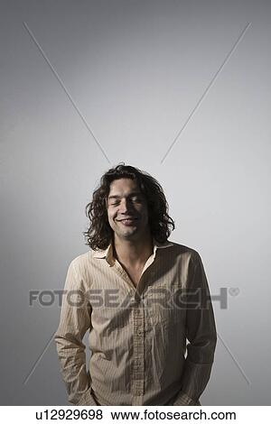 Mid-adult man smiling studio shot View Large Photo Image Stock Photo - Mid-adult man smiling studio shot. Fotosearch