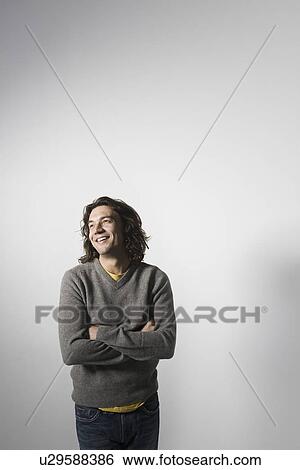 Mid-adult man smiling studio shot View Large Photo Image Stock Photograph - Mid-adult man smiling studio shot. Fotosearch