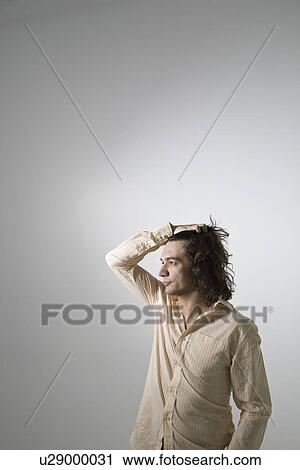 Stock Image - Mid-adult man studio shot. Fotosearch