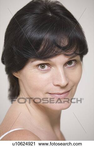 Mid adult woman wearing bra View Large Photo Image Stock Image - Mid adult woman wearing bra. Fotosearch