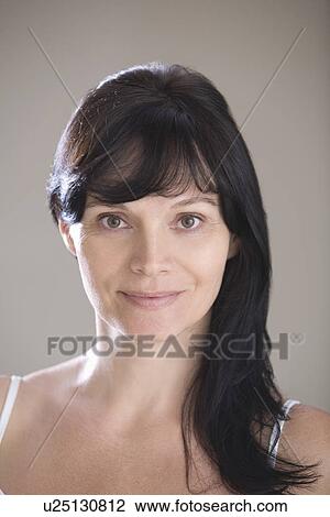 Mid adult woman wearing bra View Large Photo Image Stock Image - Mid adult woman wearing bra. Fotosearch