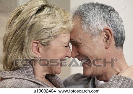 Middle-aged couple hugging close-up View Large Photo Image Picture - Middle-aged couple hugging close-up. Fotosearch