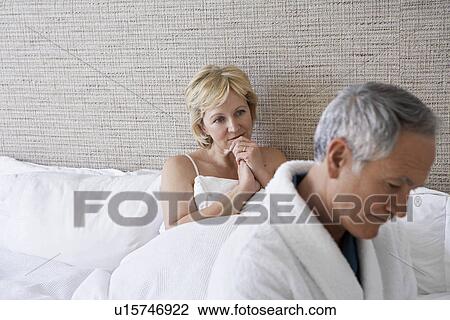 Middle-aged couple in bedroom View Large Photo Image Stock Image - Middle-aged couple in bedroom. Fotosearch