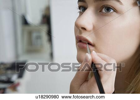 Stock Image - Model Having Makeup Applied. Fotosearch